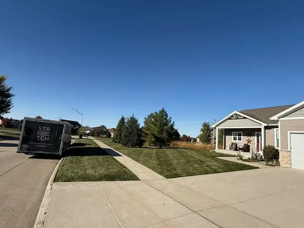 Stretch Property Maintenance performed weekly mowing at residential home in Cherry Glen Estates neighborhood in Ankeny, IA