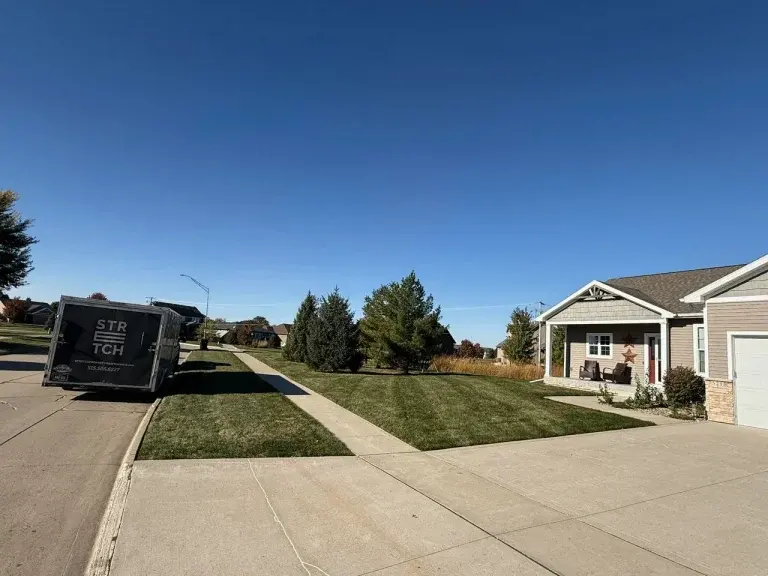 Stretch Property Maintenance performed weekly mowing at residential home in Cherry Glen Estates neighborhood in Ankeny, IA