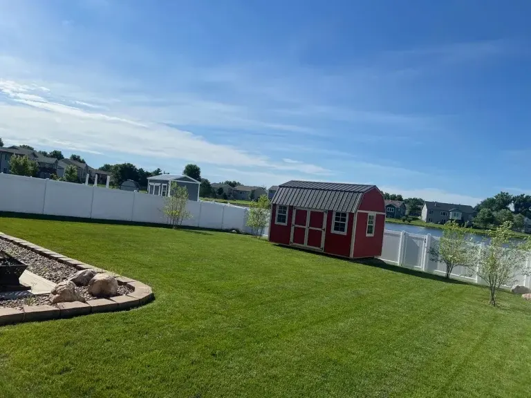 Weekly lawn mowing, trimming, and edging completed at a residential home in Granger, IA.