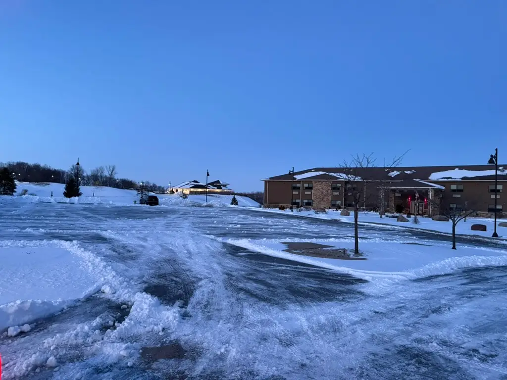 Commercial parking lot cleared of snow in Polk City, IA by Stretch Property Maintenance