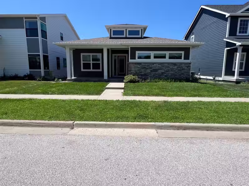 Before: front lawn at a West Des Moines, IA home before weekly mowing